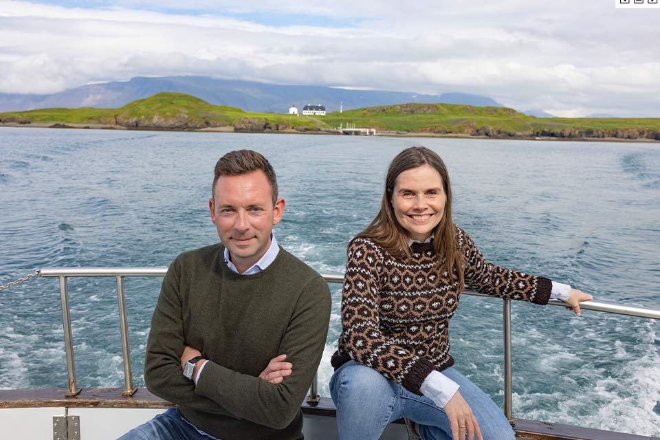 A photograph of Katrín Jakobsdóttir & Ragnar Jónasson on a boat at sea